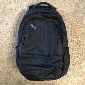 Black Jansport multi-pocket backpack